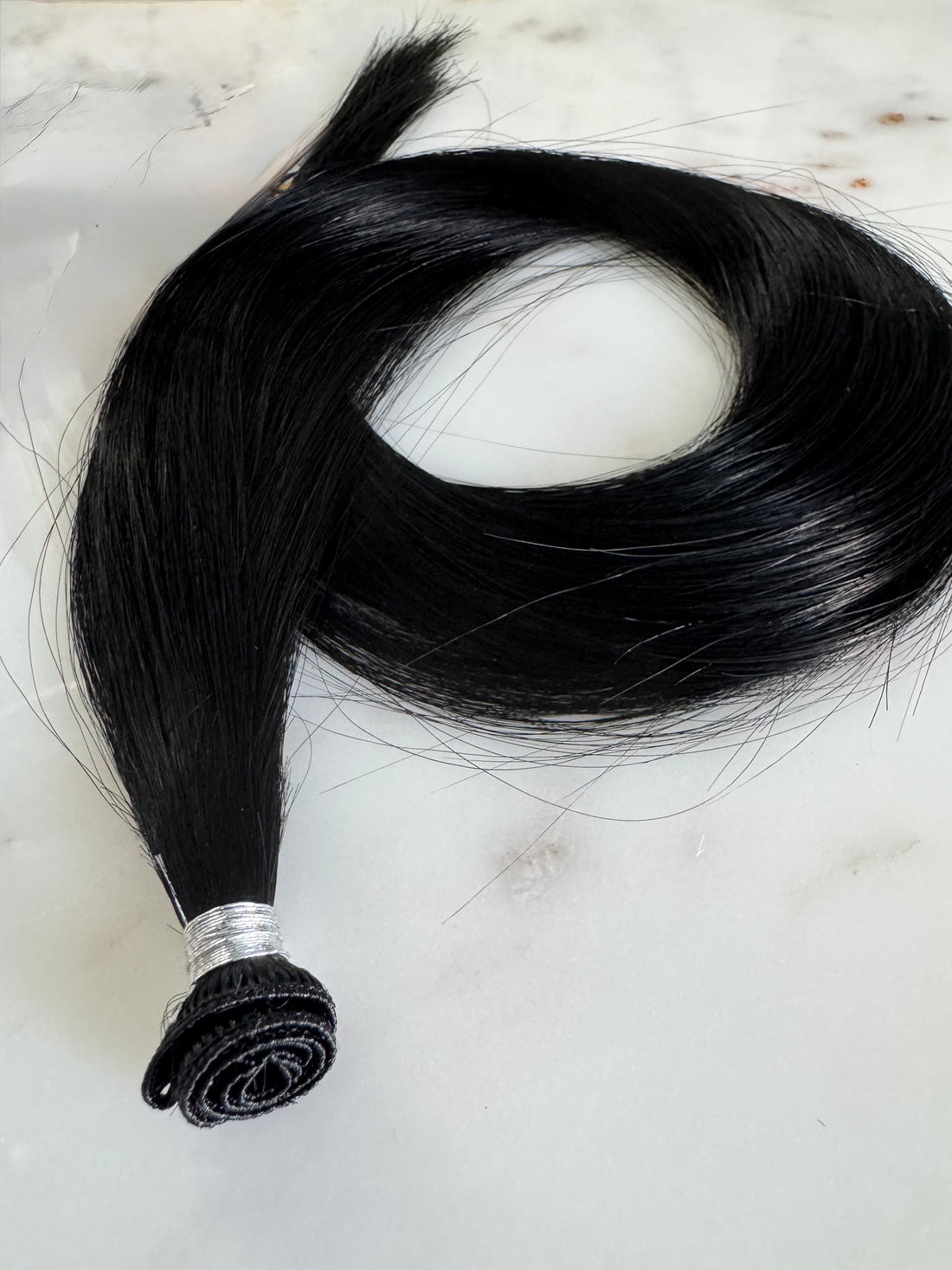 Warm blonde hand tied weft hair extensions