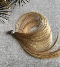 Load image into Gallery viewer, Amanda Bronde hand tied hair weft showing blended brown and blonde tones