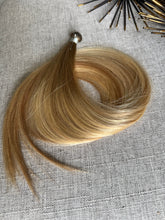 Load image into Gallery viewer, Amanda Bronde hand tied hair weft coiled on neutral fabric