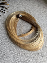 Load image into Gallery viewer, Amanda Bronde hand tied hair weft arranged in a loop on neutral fabric