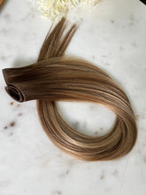 Load image into Gallery viewer, Amanda warm bronde hybrid hair extension weft arranged in a centered full product view