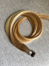 Load image into Gallery viewer, Brooke hand tied hair extension in a warm bronde blend, angled product view