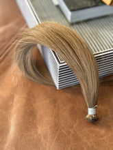 Load image into Gallery viewer, Chai Tea dirty blonde hand-tied hair extension weft arranged in a full product view