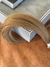 Load image into Gallery viewer, Close view of the Chai Tea dirty blonde hand-tied hair extension weft color and texture