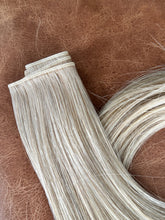 Load image into Gallery viewer, Champagne hybrid weft showing the top seam and hair length