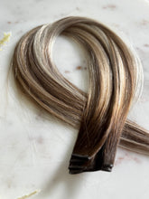 Load image into Gallery viewer, Darcie 22-inch hybrid weft hair extensions showing bronde highlights and rooted color