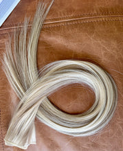 Load image into Gallery viewer, Holly 22-inch hybrid weft hair extensions arranged in a coil
