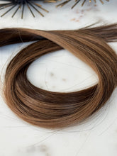 Load image into Gallery viewer, Jodie 22-inch hybrid weft arranged to show the smooth hair length and color