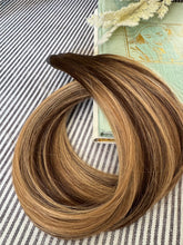 Load image into Gallery viewer, Kallee 22-inch hybrid weft hair extension arranged in a styled product overview