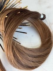Detail view of the Megan 20-inch hand-tied weft hair and bound end