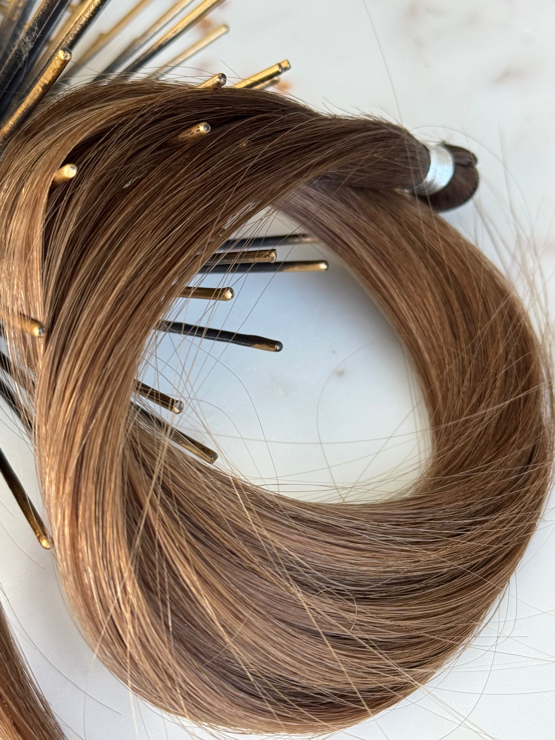 Detail view of the Megan 20-inch hand-tied weft hair and bound end