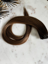 Load image into Gallery viewer, Megan Hybrid Weft 22-inch rooted brunette hair extension showing its color and length