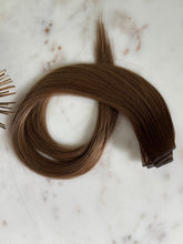 Load image into Gallery viewer, Megan Hybrid Weft 22-inch rooted brunette hair extension shown from above