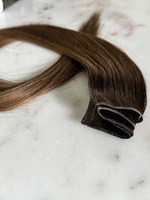 Load image into Gallery viewer, Close-up of the Megan Hybrid Weft 22-inch hair extension weft construction