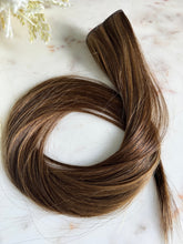 Load image into Gallery viewer, Sasha 22-inch hybrid weft hair extension showing color and texture